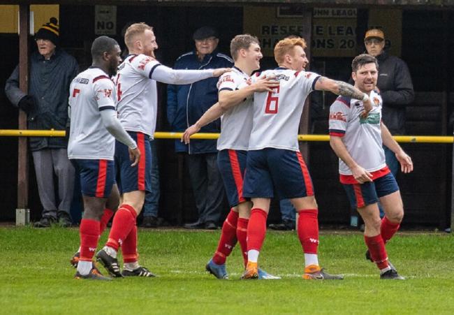 Team spirit: Witham Town's players celebrate after scoring at Stowmarket Town. Picture: JIM PURTILL