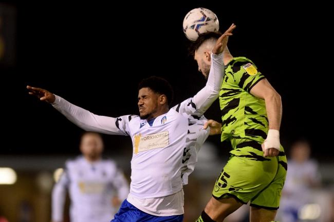 High rise - Colchester United's Corie Andrews win a header in the air against Jordan Moore-Taylor of Forest Green Rovers during the U's 2-0 Picture: RICHARD BLAXALL