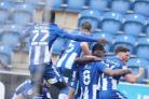 Smart - Colchester United's players celebrate scoring against Southend United last season in their one-off kit Picture: STEVE BRADING