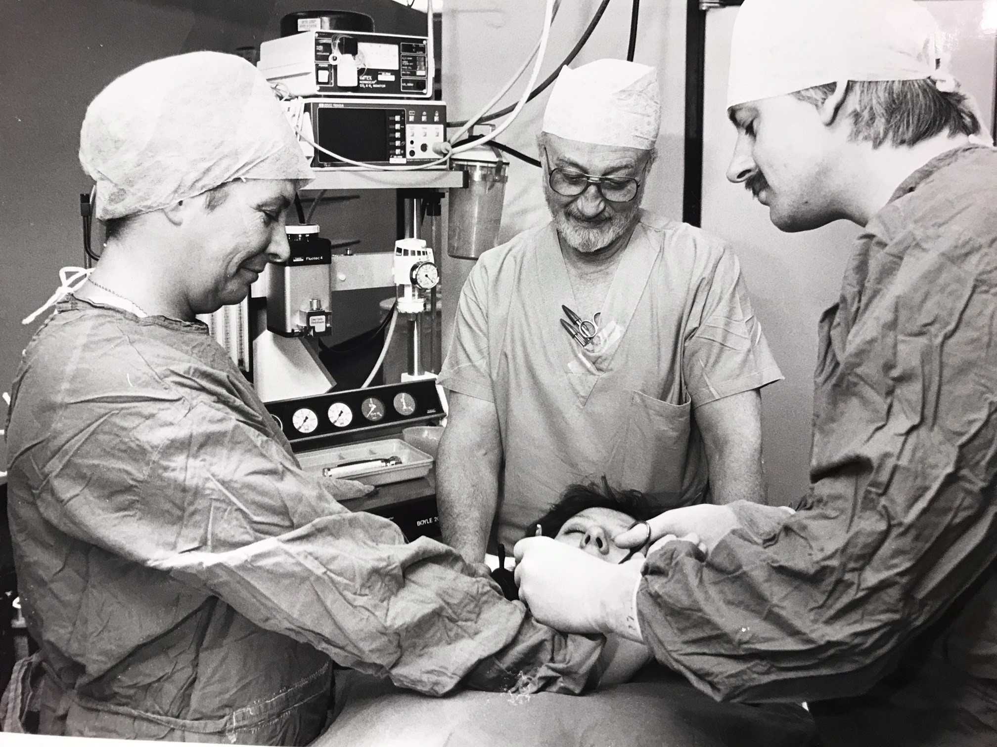 Surgery - surgical teams with a patient at the hospital in October 1988