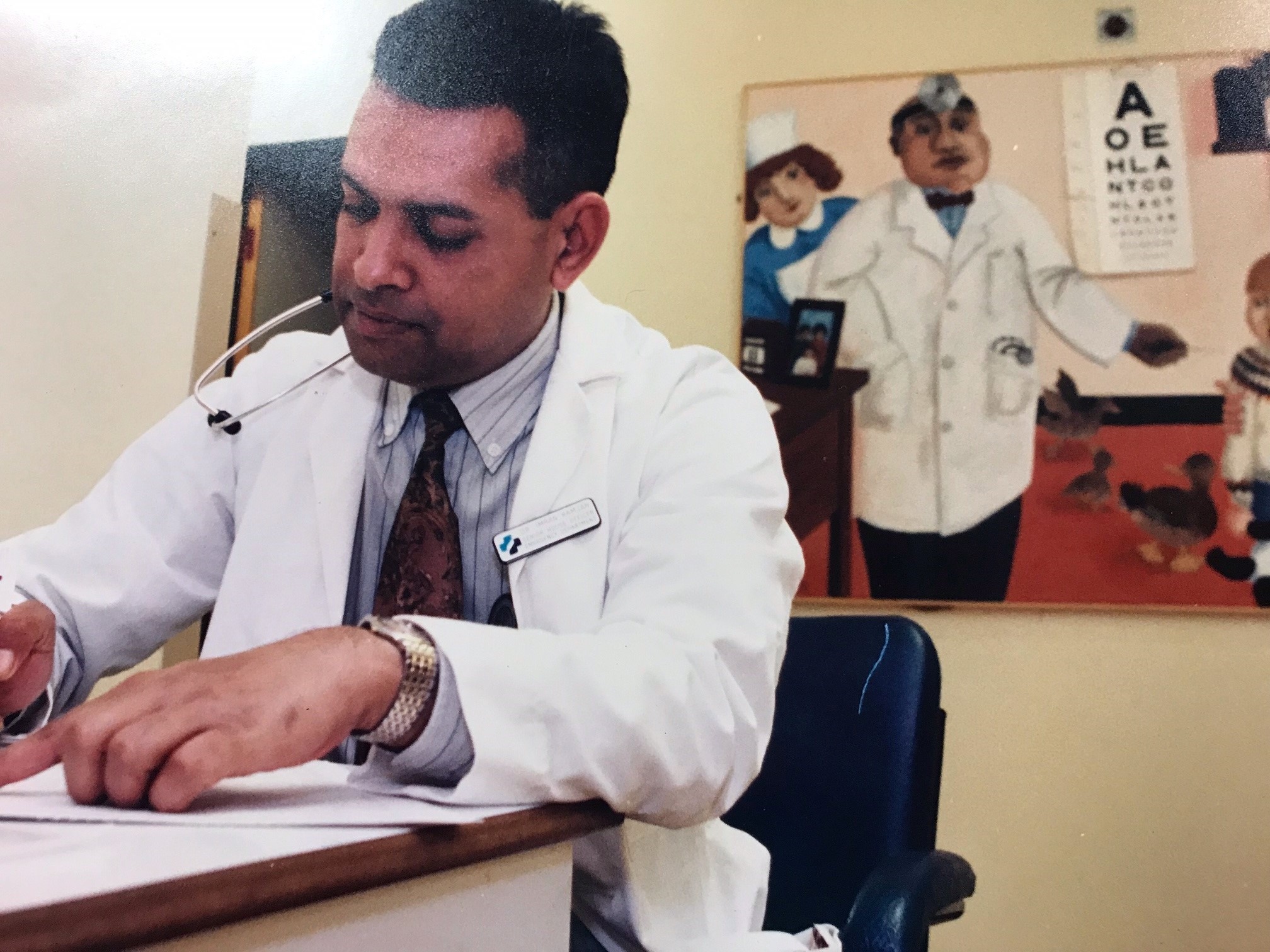 Notes - doctor Imran Ramjan writing up patient notes in 1995