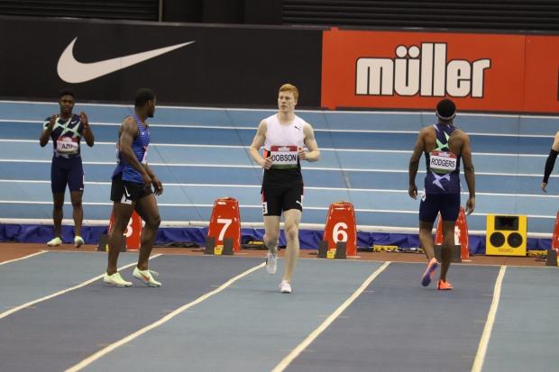 Sprint star - Charlie Dobson (white vest) in action alongside American sprinter Mike Rodgers at the Muller Indoor Grand Prix Picture: JAMES RHODES