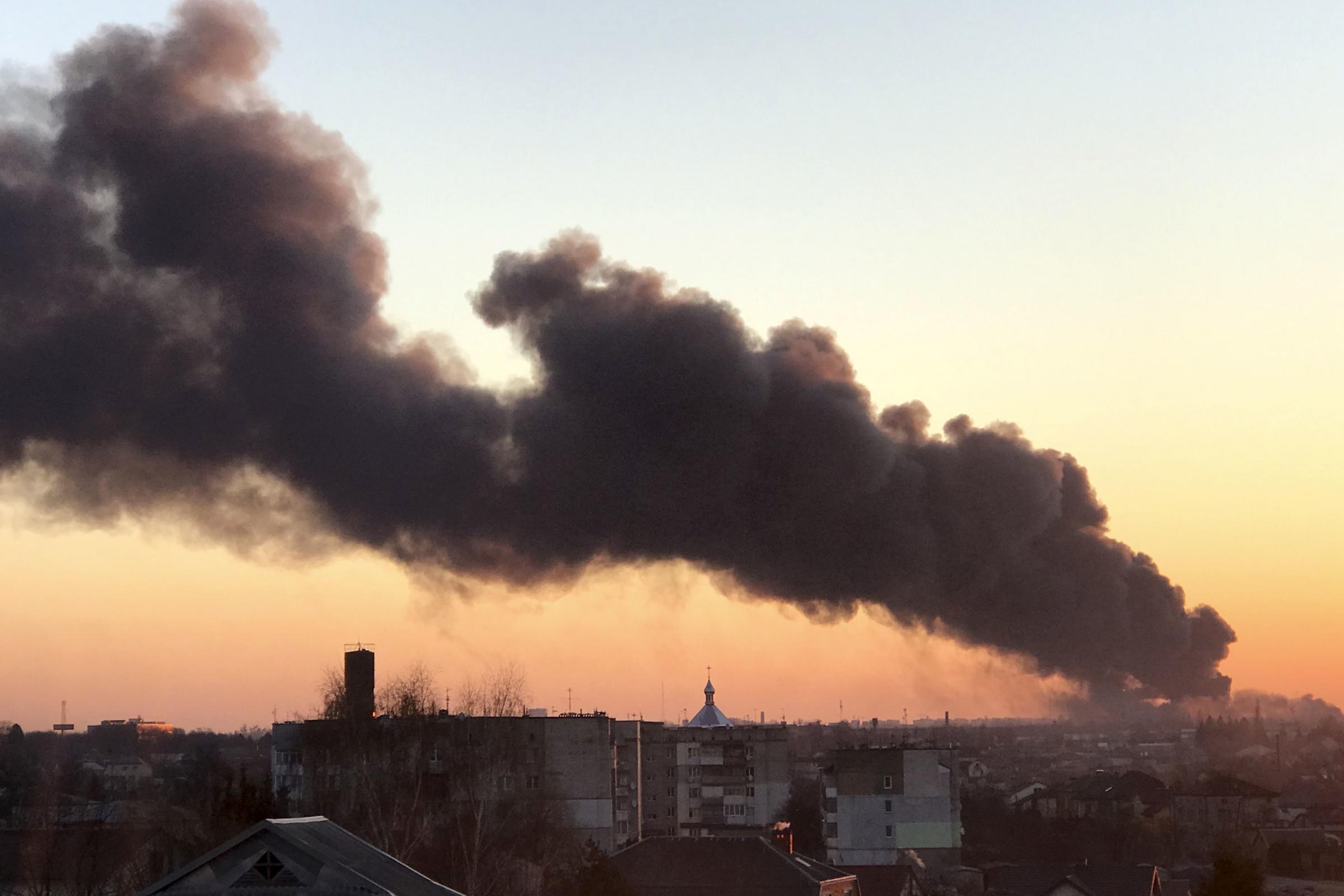 A cloud of smoke raises after an explosion in Lviv, western Ukraine, Friday, March 18, 2022. The mayor of Lviv says missiles struck near the citys airport early Friday. (AP Photo) 