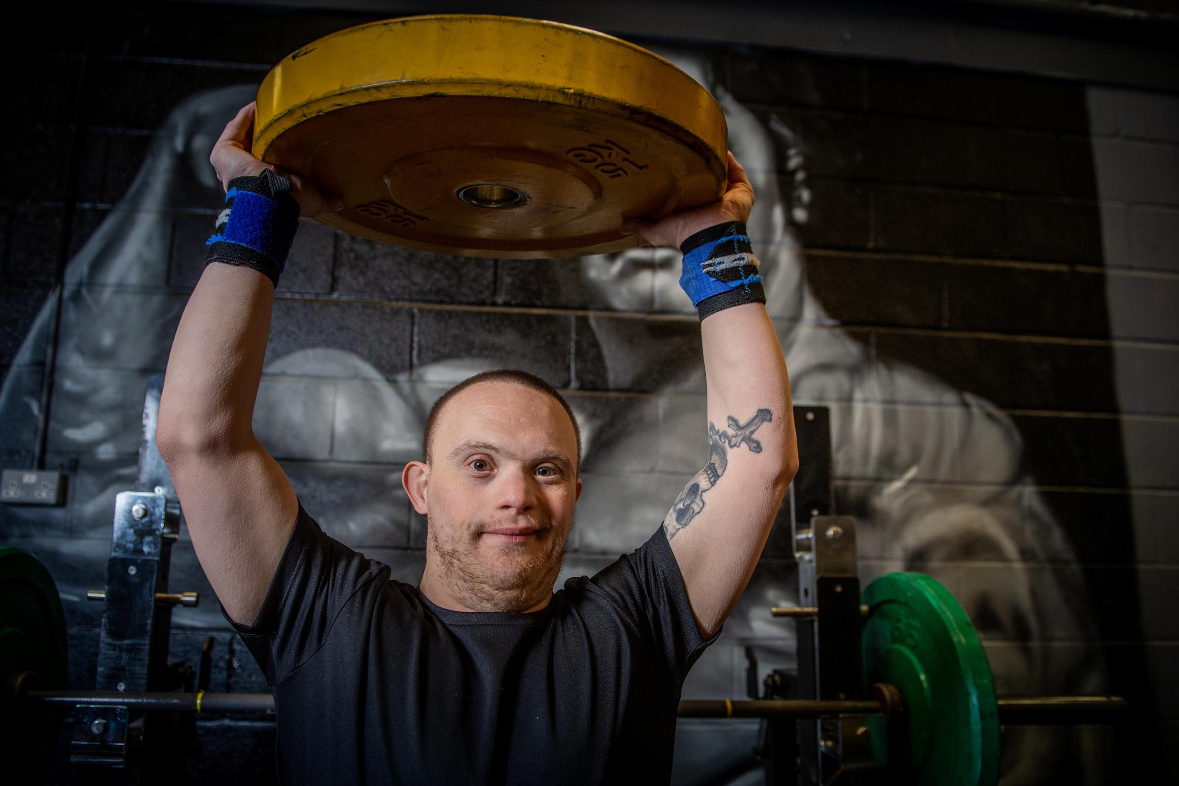 Daniel McGauley doing a workout at his gym in Colchester Essex. Powerlifter Daniel, who has Downs Syndrome and autism has been crowned British Champion. See SWNS story SWCAlift. A powerlifter with Downs Syndrome whose parents were told he would never