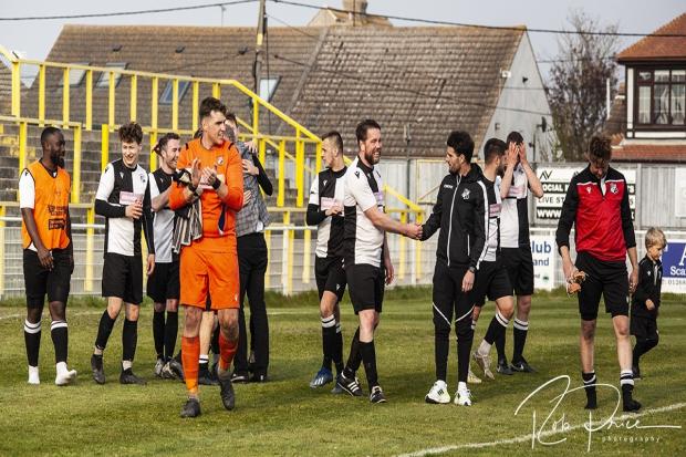 Progress - Halstead Town's players celebrate after beating Benfleet and booking a play-off final with Buckhurst Hill Picture: ROB PRICE PHOTOGRAPHY