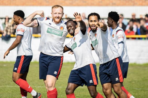 Celebration: Witham Town's players celebrate scoring against Saffron Walden Town in their inter-league play-off. Picture: JIM PURTILL