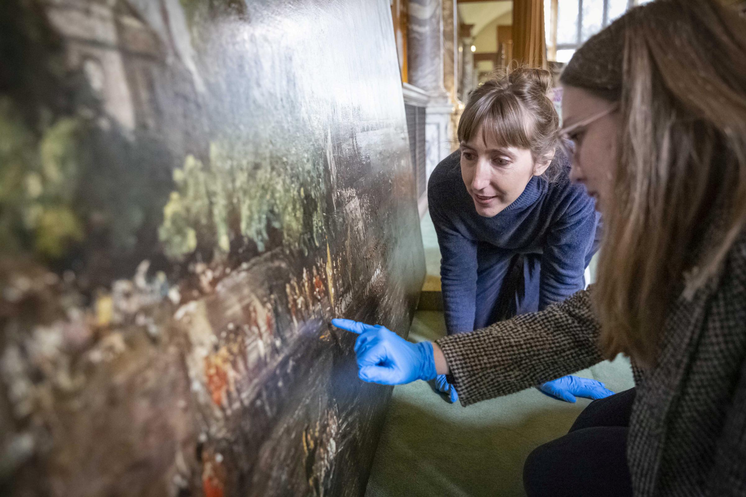 Details - curators at the National Trust examine the largest known painting by John Constable. Picture: National Trust/James Dobson