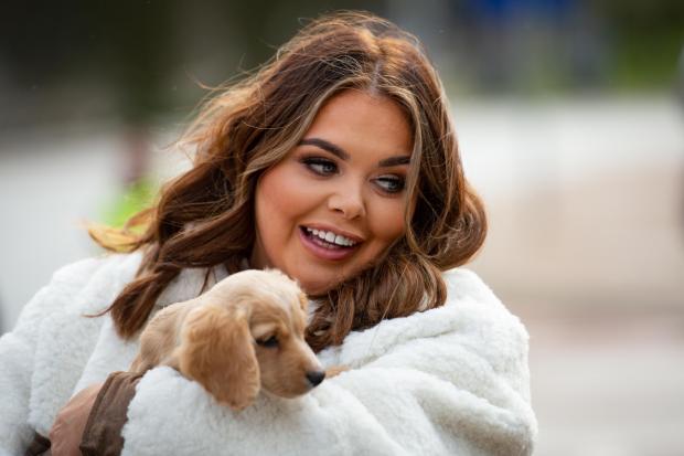 Gazette: Scarlett Moffatt holds Biscuit, a Cocker Spaniel, the Birmingham National Exhibition Centre (NEC), Birmingham, to launch the forthcoming Crufts Dog Show. (Jacob King/PA)