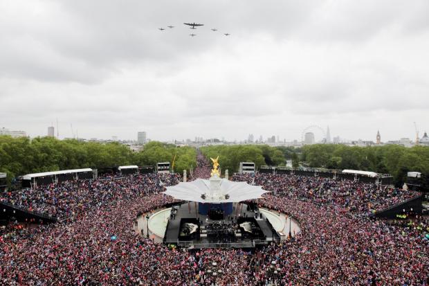 Planes flying overhead during a ceremonial flypast as Queen Elizaeth II  stands on the balcony of Buckingham Palace, London, during the Diamond Jubilee celebrations. Picture: PA