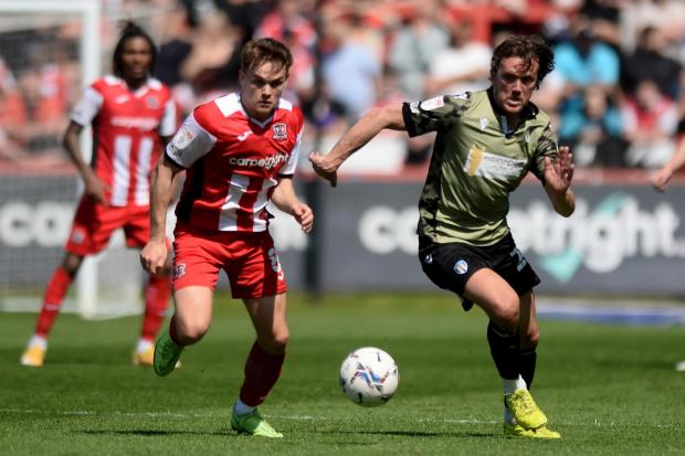 Talks - Colchester United midfielder Emyr Huws looks to get past Archie Collins of Exeter City during the game between the two sides at St James Park, in April Picture: RICHARD BLAXALL