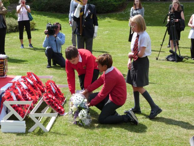 Gazette: Paying respects – schoolchildren were also invited to lay wreathes at the ceremony