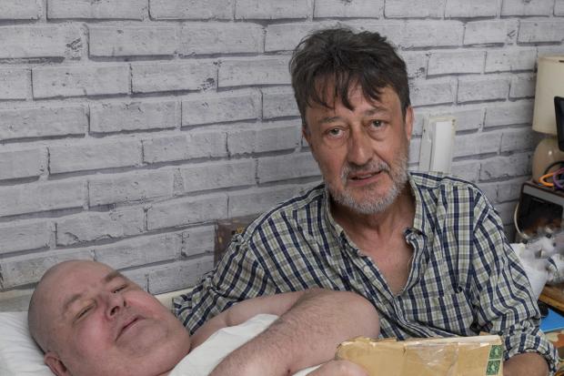 Letter - retired mechanic disabled Ian Cander (in bed) with Philip Witney and the package