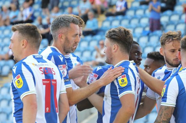 Team spirit - Colchester United's players celebrate after scoring against Carlisle United Picture: STEVE BRADING