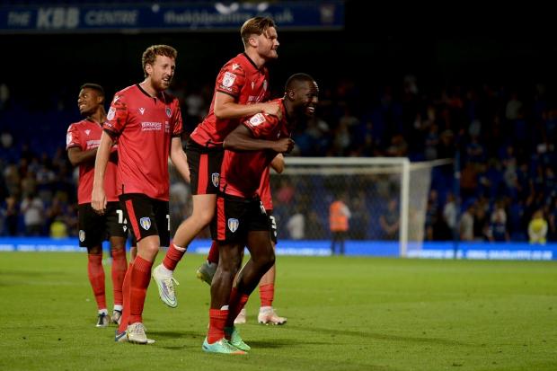 Cup of joy - Colchester United duo Frank Nouble and Noah Chilvers celebrate at the final whistle after beating Ipswich Town Picture: RICHARD BLAXALL