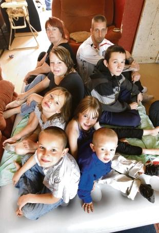 Cramped – Simon Pennell and his partner Kelly Tyler with their children Chelsea, 16, Ryan, 15, Phoebe, nine, Holly, eight, Cameron, seven, and Dolton, three