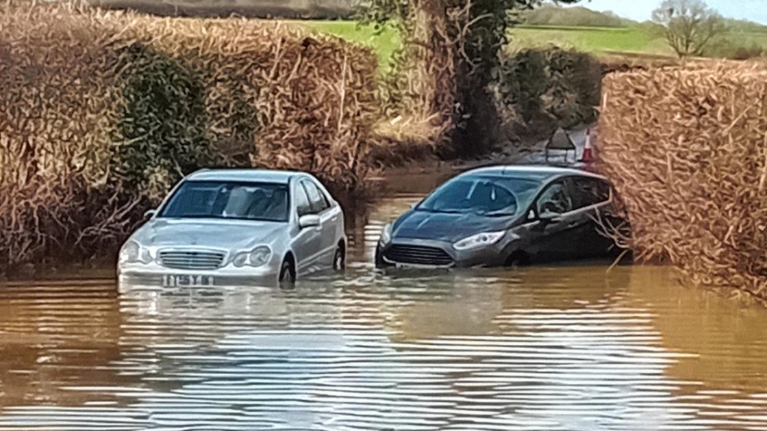 Cars abandoned in West Bergholt after road floods during torrential downpours 