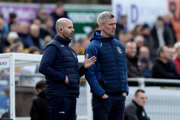 Game time - Sutton United boss Steve Morison (right) watches his side's 1-1 draw with Colchester United