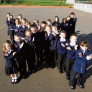 Come on, Olly! Pupils from Howbridge Church of England Junior School, Witham, form an X in support of Olly