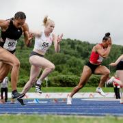 Pace - Colchester's Rebecca Jeggo (white vest, number 55) competes at the Welsh Senior and U15 Athletics Championships at the Cardiff International Sports Campus Picture: JOHN SMITH