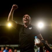 Derby delight - Colchester United boss Wayne Brown celebrates at the final whistle after his side's finr 1-0 win at Ipswich Town Picture: RICHARD BLAXALL