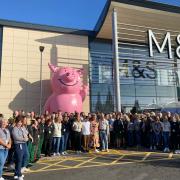 Staff at the new Marks and Spencer posed for photographs before the new store opened on Wednesday morning