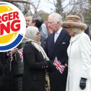 Surprise – Camilla was greeted by cheering crowds and was offered a Burger King hat, before she took it into the royal cavalcade