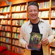 All smiles - Jamie Oliver promoting his new book Billy And The Giant Adventure in his local bookshop, Harts, in Saffron Walden