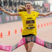 Golden girl - Colchester's Lyla Belshaw crosses the finish line at the Mini London Marathon