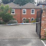 Cordon - a courtyard is shut off by police officers off Fairfax Road