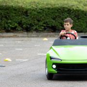 Speedy - A young driver behind the wheel of the scaled down Firefly Sport