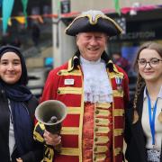 Celebration - Colchester's town crier Robert Needham visited the university in celebration of Essex Day, in the picture with Fatima Ramadan (left) and Margaux Bonbony (right)