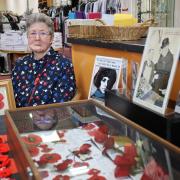 Display - Historian and author Heather Johnson with the poppy display at the St Helena Books, Brew and Boutique at the Angora Business Park in Stanway