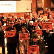 Opposed – campaigners at West Bergholt Village hall don placards to show their opposition to the pylon plans