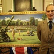 Proud - artist Hugh Beattie with his painting
