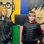 Family - Alan's sons Harry, 19, and Charlie, 16 in front of the mural