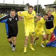 Magic moment - Brian Owen (second from right) celebrates at Huish Park after Phil Parkinson (first left) led Colchester United to promotion from League One, in 2006