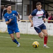 Speed: Witham Town's Archie McFadden (right) races down the wing during his side's game with Bury Town.