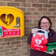 Happy - Angela Linghorn-Baker with the new defib at St Cedd's Church