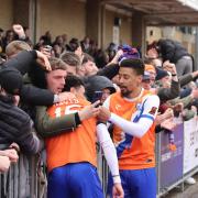 Magic moment:  Jayden Davis celebrates with his team-mates and fans after scoring Braintree Town's winner at Chelmsford City.
