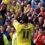 Memorable moment - Colchester United striker Chris Iwelumo celebrates with the club's fans at Yeovil Town after their historic promotion to the Championship, in 2006