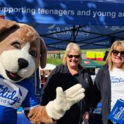 Happy - the Tom Bowdidge Youth Cancer Foundation mascot, Niki Bowdidge, and Lindsay Hurrell