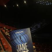 The stage and provided programme at Mercury Theatre, Colchester.