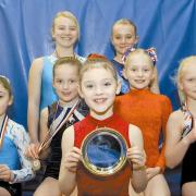 Success  Stourdale Gymnastic Club's Bobbi Lennard, Jessica Coe, Jacinta Allen, Jorgia Vaughan, Chloe Rose, Megan Paddock and Alice Browning show off their medals and trophies. (767895-5)