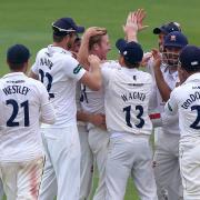 Star man - Essex's Simon Harmer is congratulated by his team-mates after taking the wicket of Andrew Umeed Picture: GAVIN ELLIS/TGSPHOTO