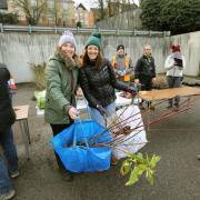 Plant power - Two happy residents recieve their plants from a previous Trees for Years event.