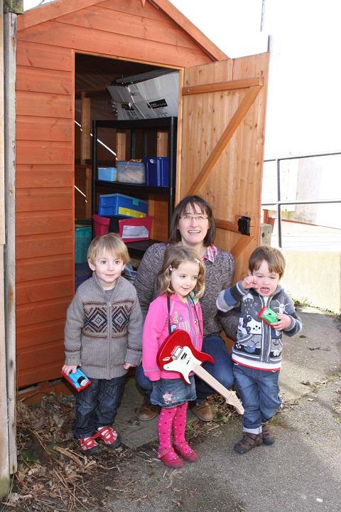From left, Noah, Molly, Emma Appleton and Finlay outside the Wivenhoe Toddler Group’s new toy shed.