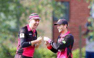 All smiles - Colchester and East Essex captain Darren Eckford (left) celebrates a wicket with team-mate Julian Russell against Billericay Picture: TRACY HILLS