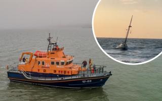 Lifeboat crews endure 11-hour rescue mission to save yacht skipper who fell overboard