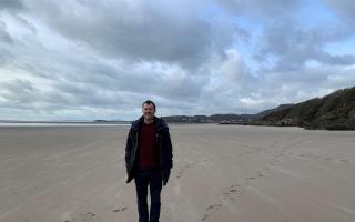 Neil Jones on a beach