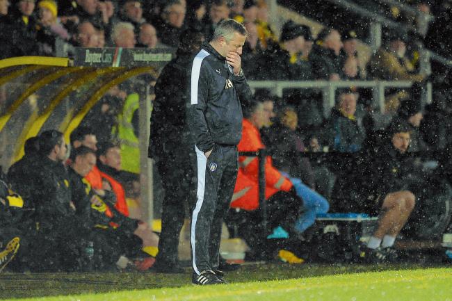 Testing times - interim joint manager Richard Hall in the technical area during Colchester United's 5-1 defeat at Burton Albion. Picture: RICHARD BLAXALL